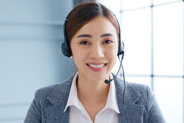 Portrait Young Asian businesswoman, call center, customer service talking on video call conference...
