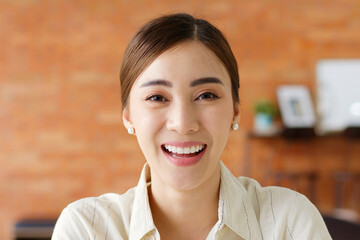 Portrait young beautiful Asian business woman in casual suit look at camera and smile