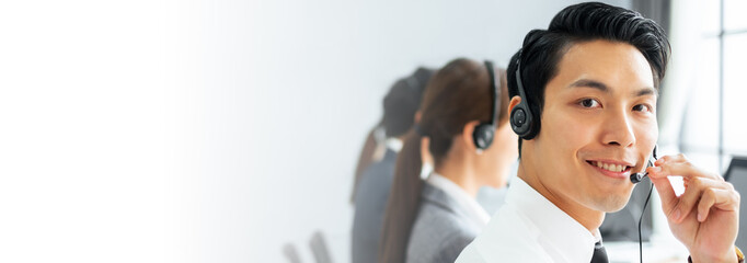 Banner Asian man call center, customer service, telesales in casual touch headset or headphone and...