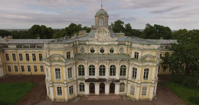 4K cloudy day aerial drone video of beautiful vintage architecture of Znamenka Estate, green park and palace near Peterhof center, in the suburbs of Saint Petersburg, the Russia's northern capital