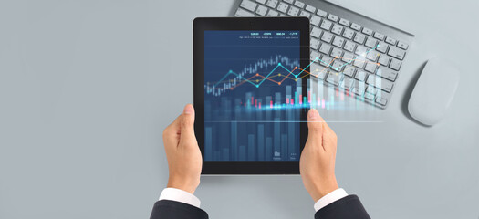 Obraz na płótnie Canvas Business plan graph growth increase of chart positive indicators in his business,tablet in hand