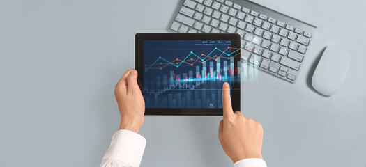 Business plan graph growth  increase of chart positive indicators in his business,tablet in hand