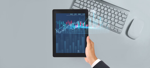 Business plan graph growth  increase of chart positive indicators in his business,tablet in hand