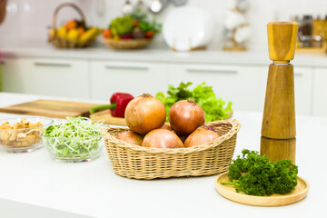 The ingredients for cooking are placed on table in kitchen.