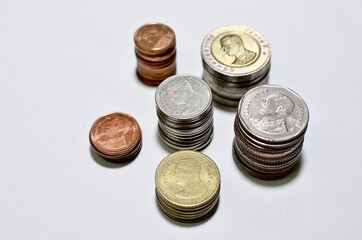 Thai coins stacked on white background