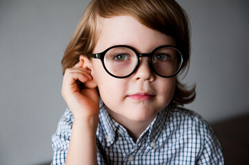 Portrait of a cute child in vision-correcting glasses.