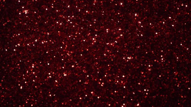 Abstract background, shining, sparkling lights of red color glitter texture, 4K