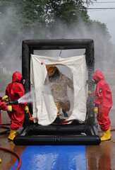 Firefighters clean them before entering a safe area.