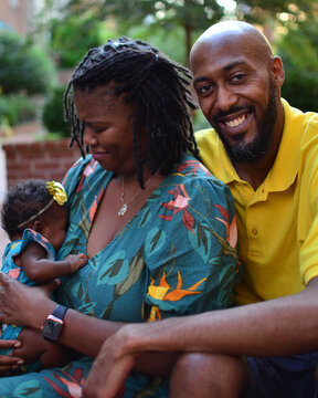 Loving African American parents with beautiful infant daughter 