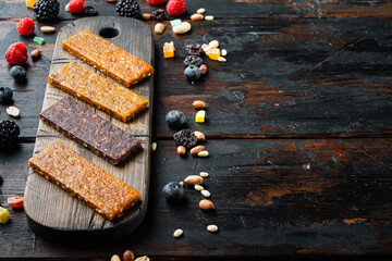 Dried fruits bars with copy space, on wooden table