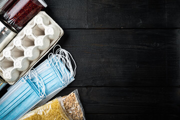 Donations food set of staple products, flat lay with space for text, on black wooden table