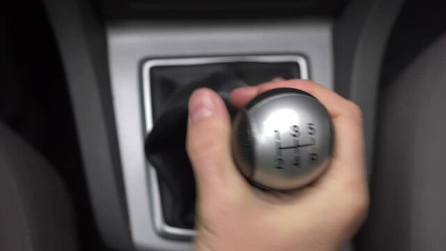 Angry Driver Changing Gears Fiercely with Manual Transmission Gear Stick