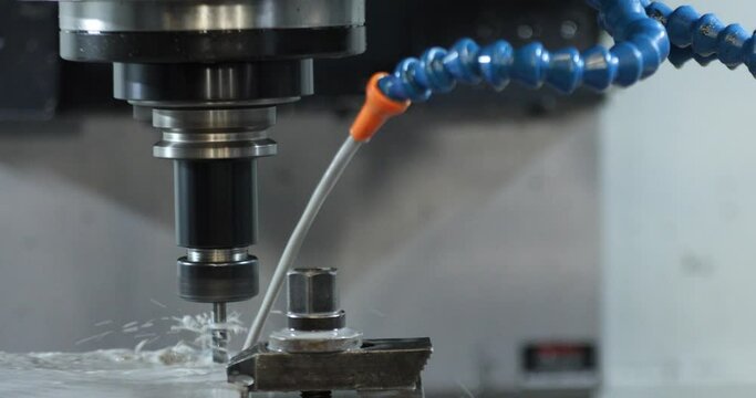 High precision Hydraulic Metal Cutting CNC machine working, operator machining automotive sample part process in factory - 4K Video