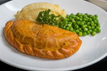 Mice Cornish pasty with potato mash and peas