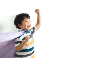Cute little Asian superhero kid on white background. Boy power concept.