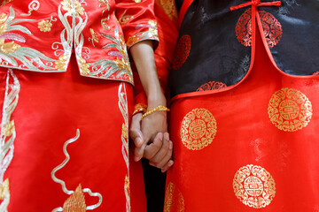Close up details of traditional Chinese Wedding Dress for groom and bride. Chinese wedding couple...