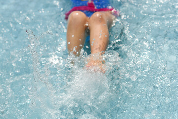 Kids having fun splashing water in poolside, summer holding concept