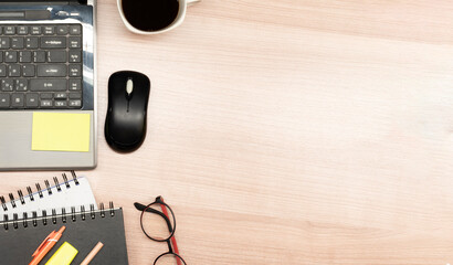 Naklejka premium Top view laptop ,coffee and accessories on table with copy space