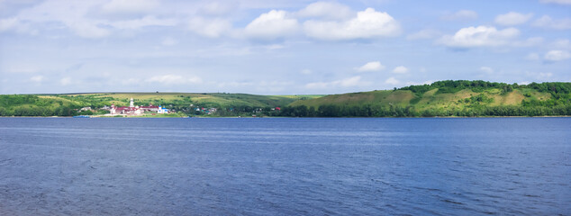 The river Volga and Vinnovka Mountains, Samara region, Russia. Holy Mother of God Monastery in Vinnovka village.