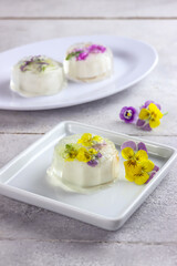 Puding mooncake or pudding jelly mooncake with edible flowers.