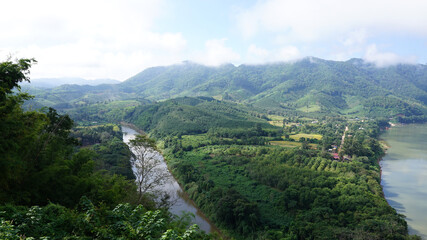 Fototapeta na wymiar Green Mountain range and Khlong river at the border of Laos from the view point of Chaing Kkhan skywalk