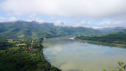 Fototapeta premium Green Mountain range and Khlong river at the border of Laos from the view point of Chaing Kkhan skywalk