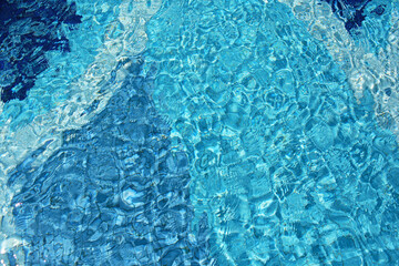 Swimming Pool Surface With Light Reflection and Water Ripple Patterns