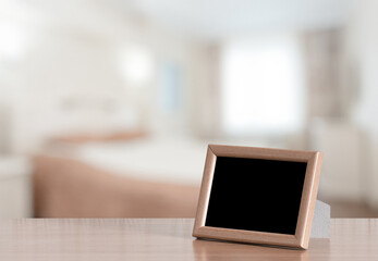 photo frame on the wooden table