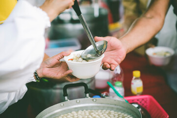 Volunteers Share Food to the Poor to Relieve Hunger: Charity food concept