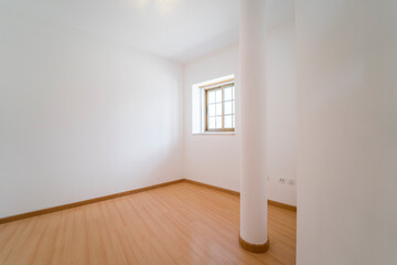 Fototapeta premium Empty room with wooden floating laminate flooring and window. House interior, wide bedroom space. Newly recently painted new apartment or house. Wood floor. Real state and property management