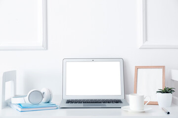 Modern laptop at workplace in office