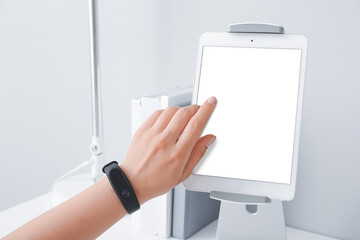 Woman using modern tablet computer in office