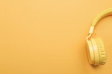 Headphones on color background, closeup