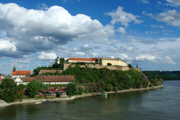 Fototapeta na wymiar panoramic view of the Petrovaradin Fortress with blue sky and white clouds in the background