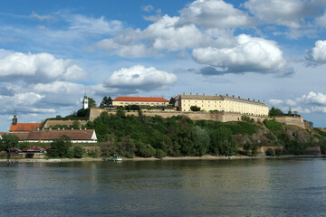 panoramic view of the Petrovaradin Fortress with blue sky and white clouds in the background