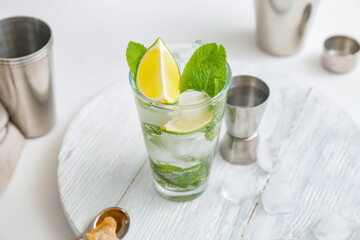 Glass of fresh mojito on table