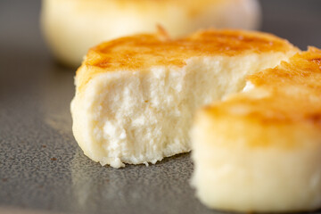 Cottage cheese pancakes or syrniki with folk closeup view. Russian, Ukrainian cuisine. Healthy tasty breakfast