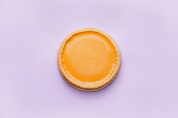 Tasty pumpkin pie on color background, top view