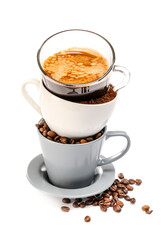 Stack of cups with coffee beans and beverage on white background