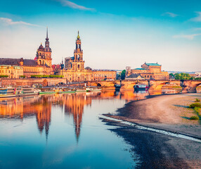 Summer evening scene of Cathedral of the Holy Trinity, Hofkirche, Bruehl's Terrace or The Balcony of Europe in Dresden, Saxony, Germany, Europe. Colorful sunset on Elbe river.