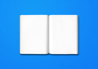 Open book isolated on blue