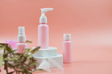Pink cosmetic bottles for cream, gel, lotion. Skincare cosmetic concept.