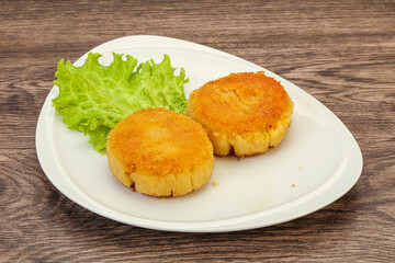 Vegan cuisine - Potato cutlet in the plate