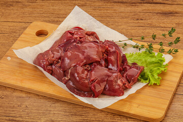 Raw chicken liver over board