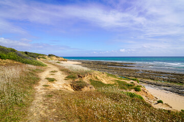 sandy french sea coast on atlantic beach ocean in summer day