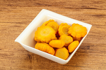 Marinated yellow patisson in the bowl