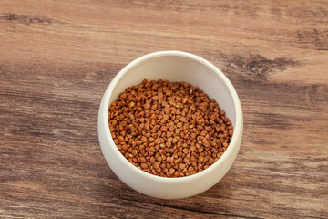 Raw buсkwheat cereal in the bowl