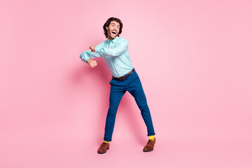 Full body photo of young attractive man happy smile positive dance crazy have fun isolated over pink color background