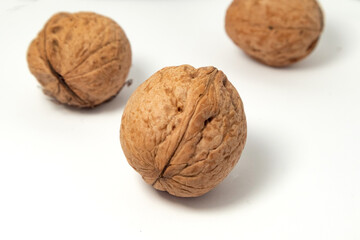 Walnuts isolated on white background. Walnut kernels and whole walnuts