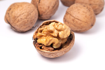 Walnuts isolated on white background. Walnut kernels and whole walnuts